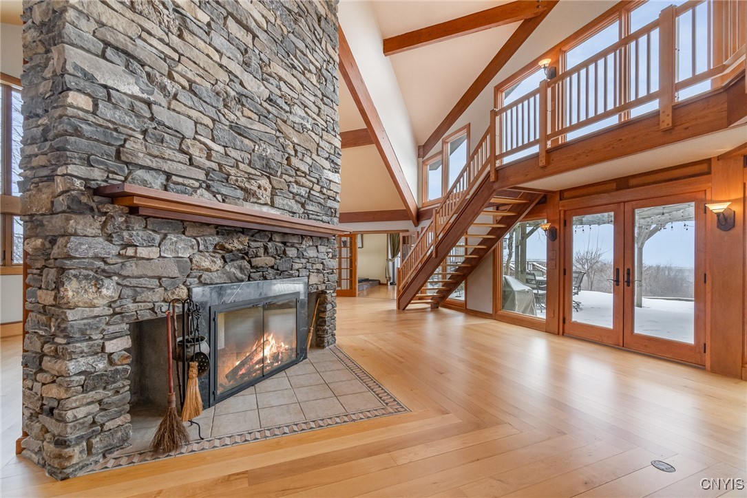 6987 Frank Long Road Pompey, NY 13078 - Photo 4 of 40 The double sided fireplace is the interior living