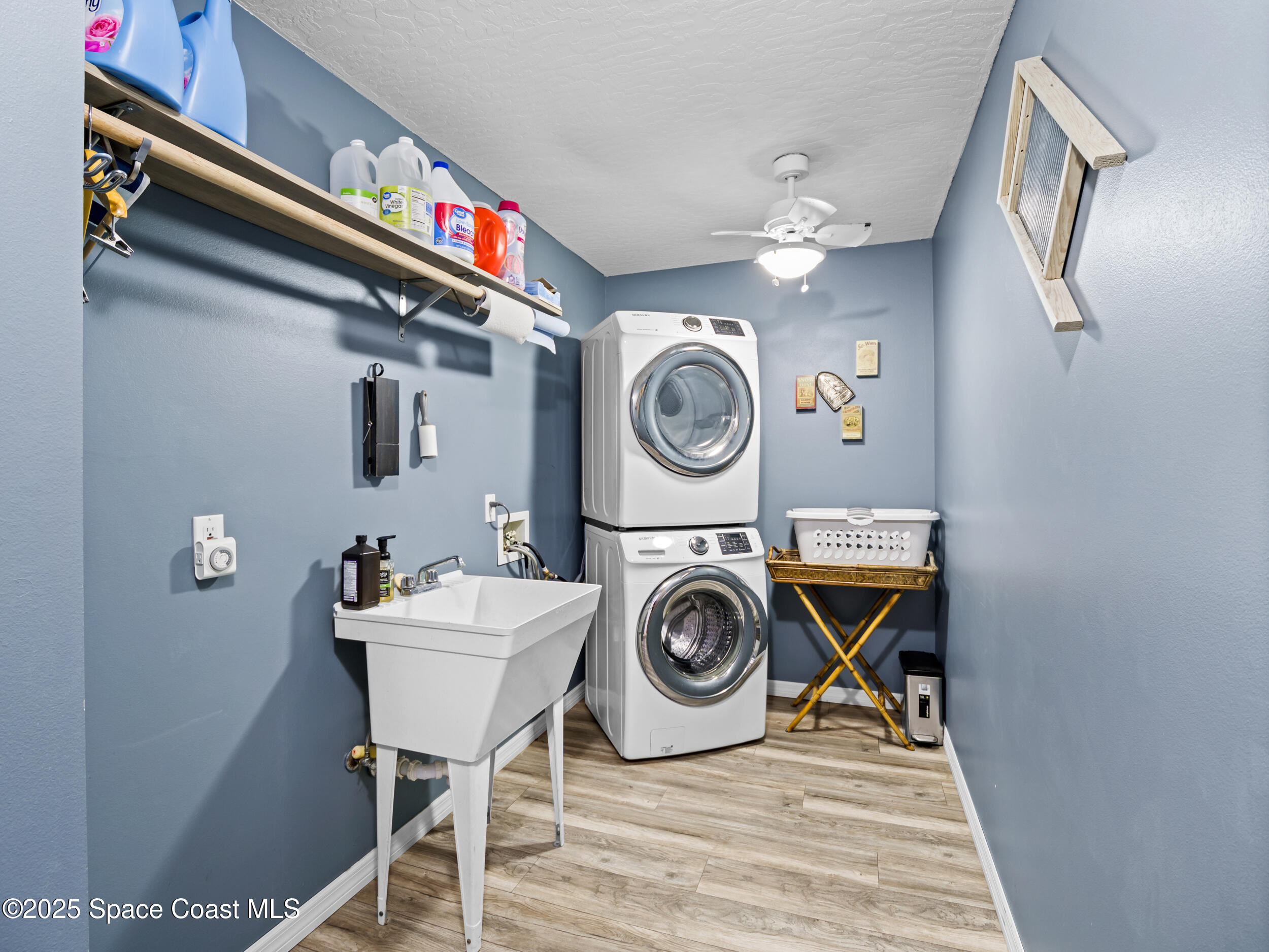 239 Deer Run Road Palm Bay, FL 32909 - Photo 17 of 43 a utility room with dryer and washer