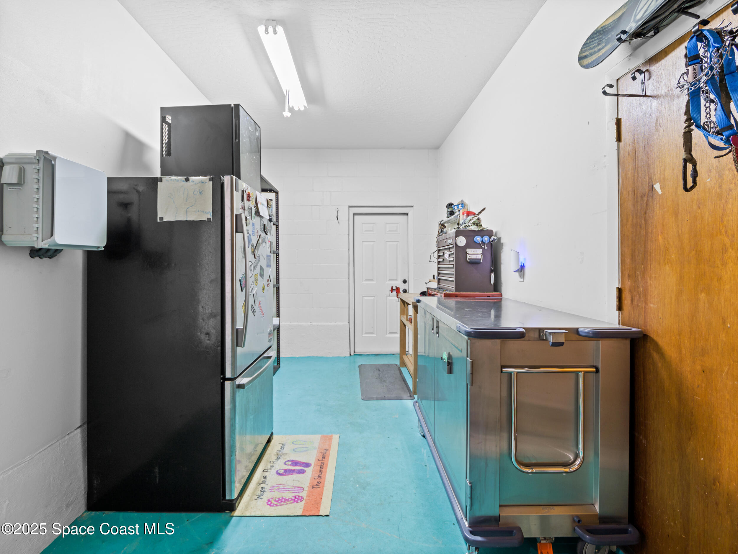 239 Deer Run Road Palm Bay, FL 32909 - Photo 18 of 43 a kitchen with a refrigerator and a stove