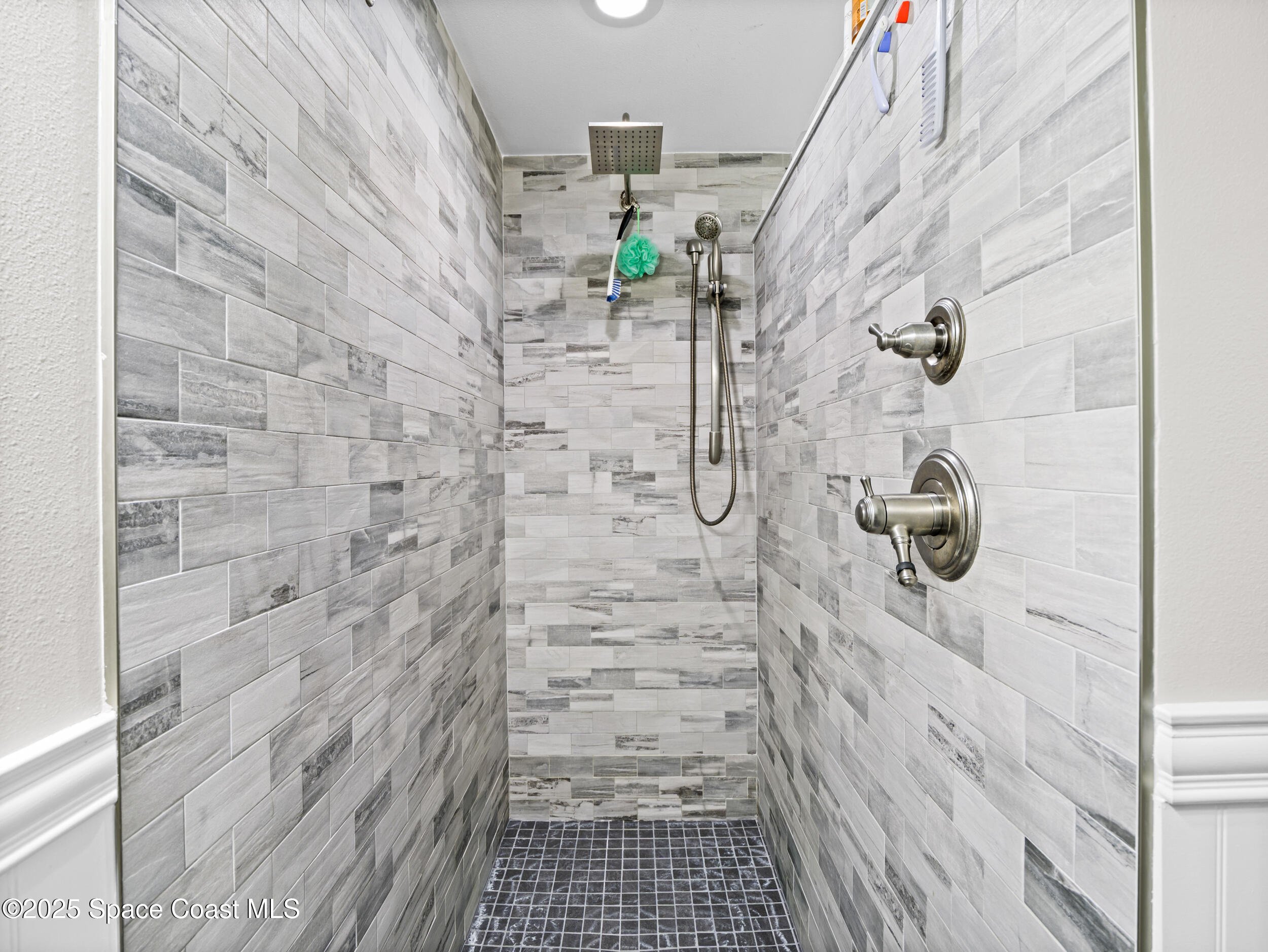 239 Deer Run Road Palm Bay, FL 32909 - Photo 21 of 43 a bathroom with a shower