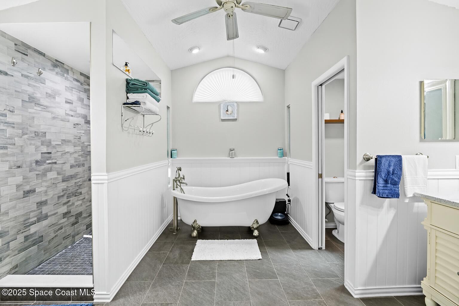 239 Deer Run Road Palm Bay, FL 32909 - Photo 22 of 43 a spacious bathroom with a bathtub and a sink