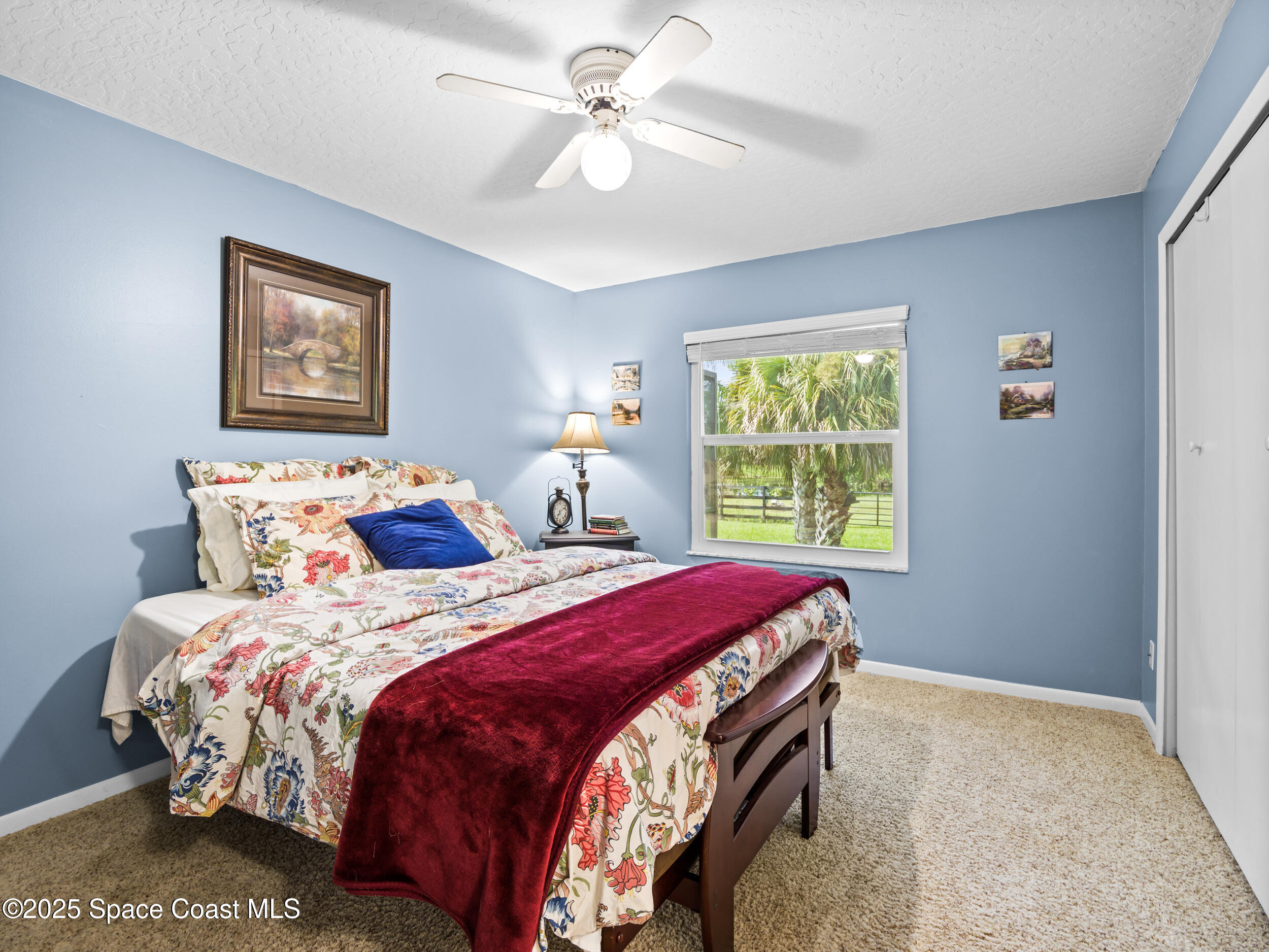 239 Deer Run Road Palm Bay, FL 32909 - Photo 25 of 43 a bedroom with bed and a window