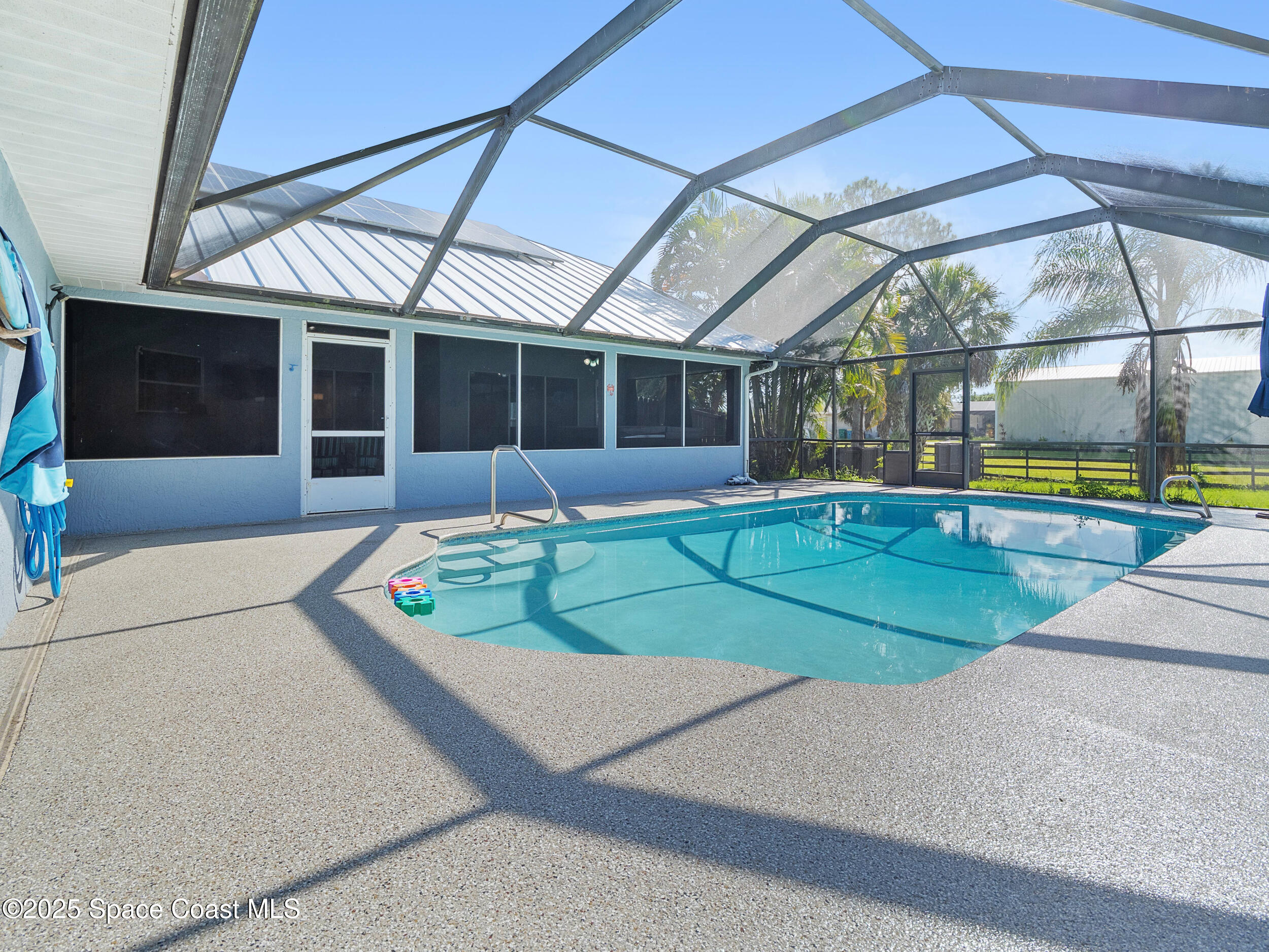 239 Deer Run Road Palm Bay, FL 32909 - Photo 29 of 43 a view of a backyard with swimming pool