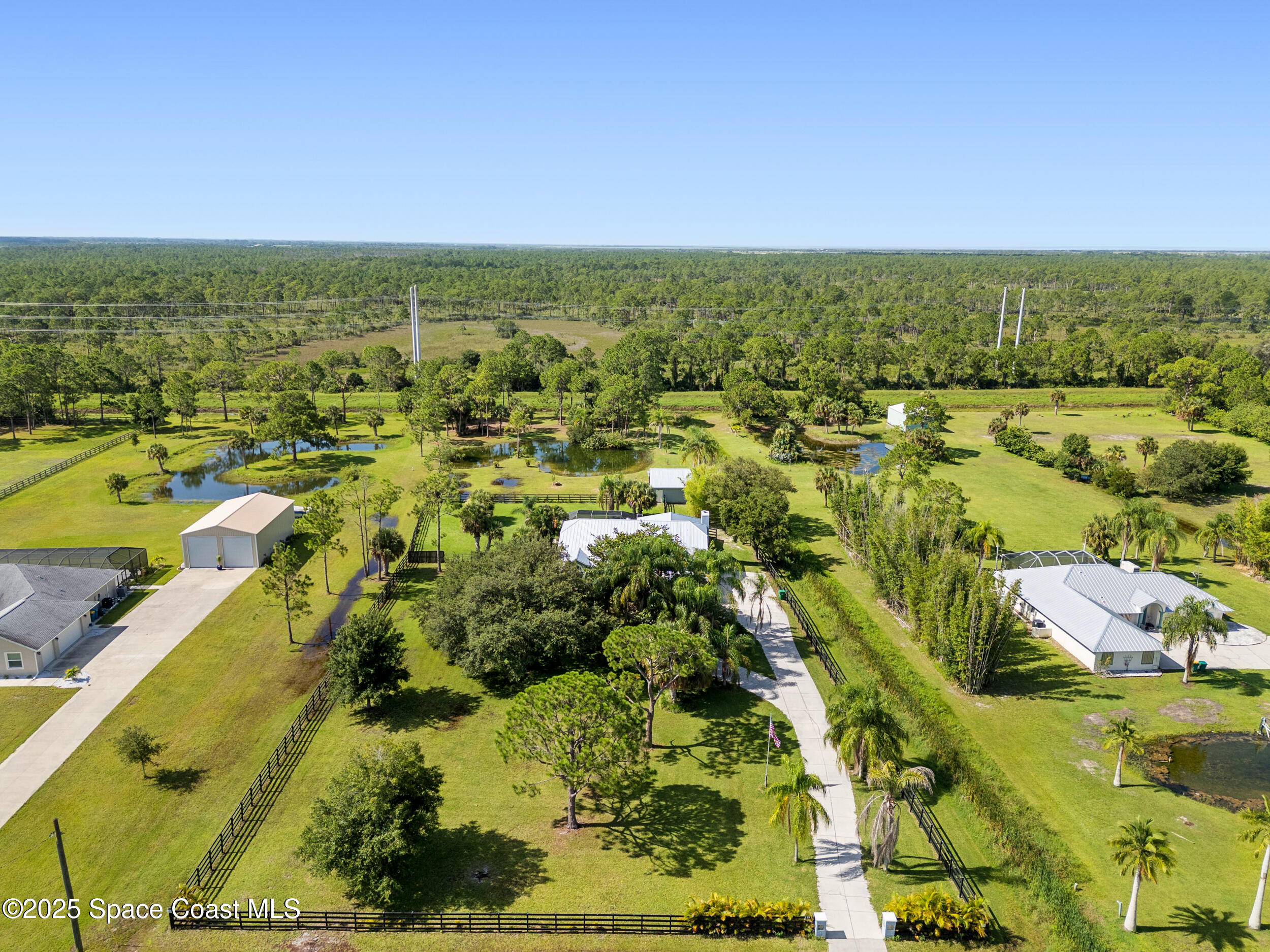 239 Deer Run Road Palm Bay, FL 32909 - Photo 37 of 43 an aerial view of residential houses with outdoor space