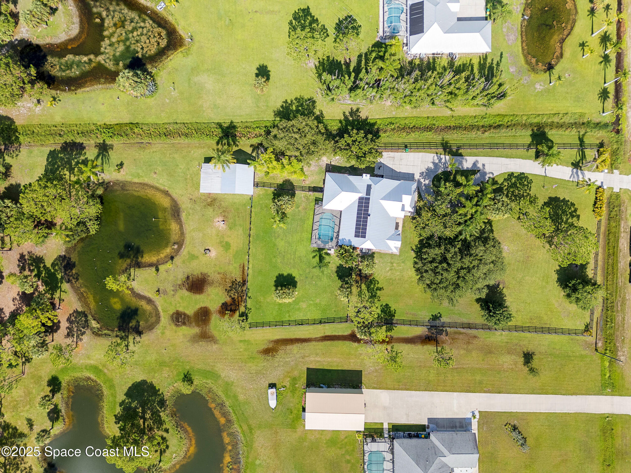 239 Deer Run Road Palm Bay, FL 32909 - Photo 38 of 43 an aerial view of a residential houses with outdoor space