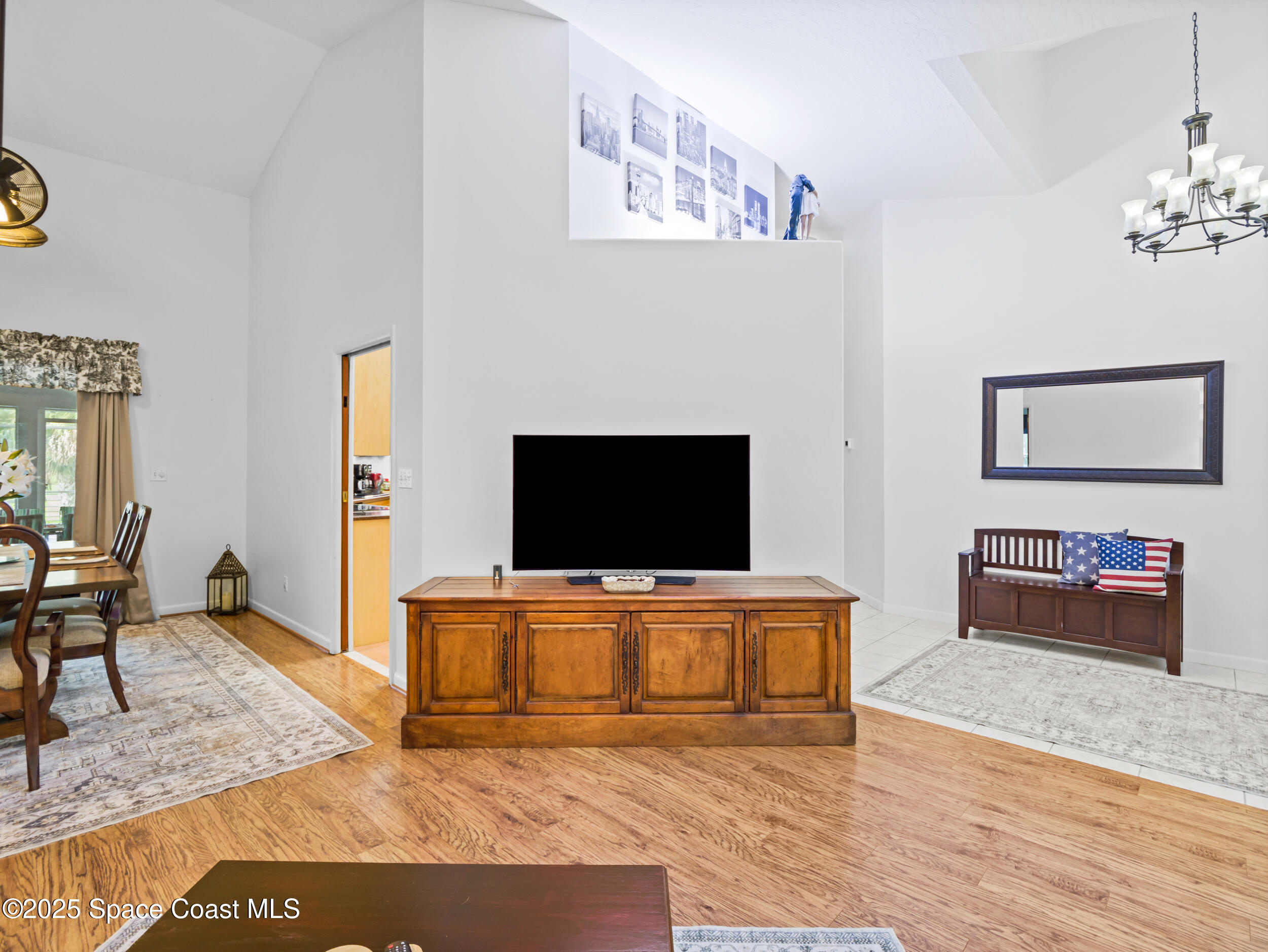 239 Deer Run Road Palm Bay, FL 32909 - Photo 9 of 43 a living room with furniture and a flat screen tv