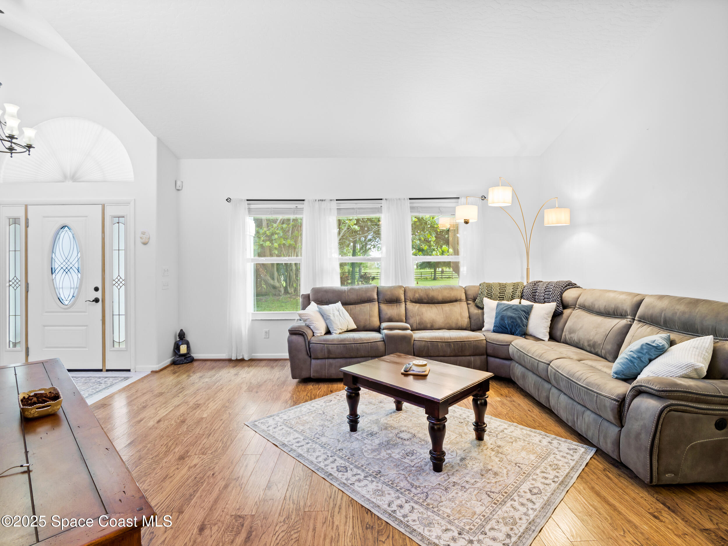 239 Deer Run Road Palm Bay, FL 32909 - Photo 10 of 43 a living room with furniture and a large window
