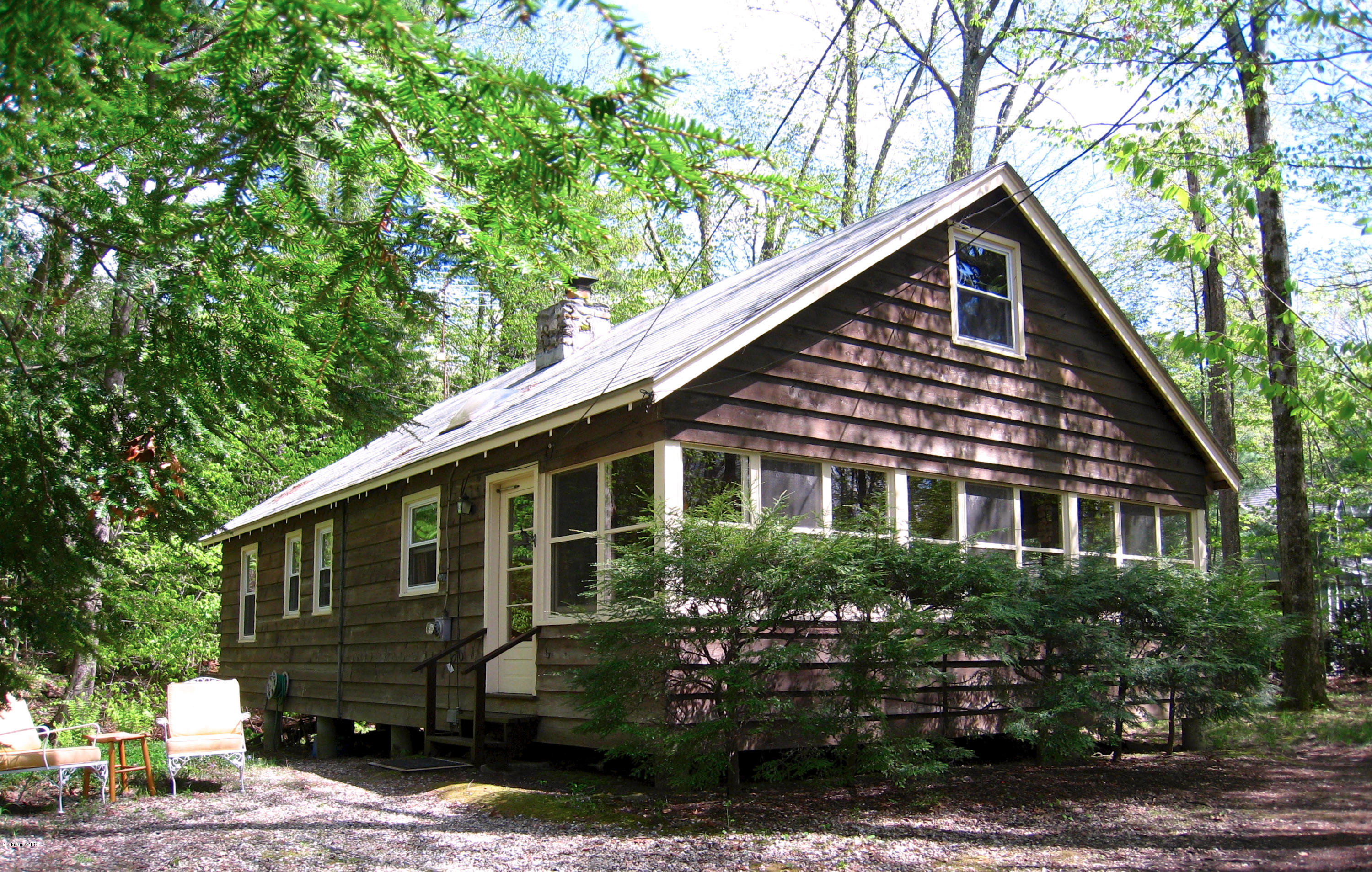 22 Housatonnuck Road Stockbridge, MA 01262 - Photo 18 of 21 a front view of a house with a garden