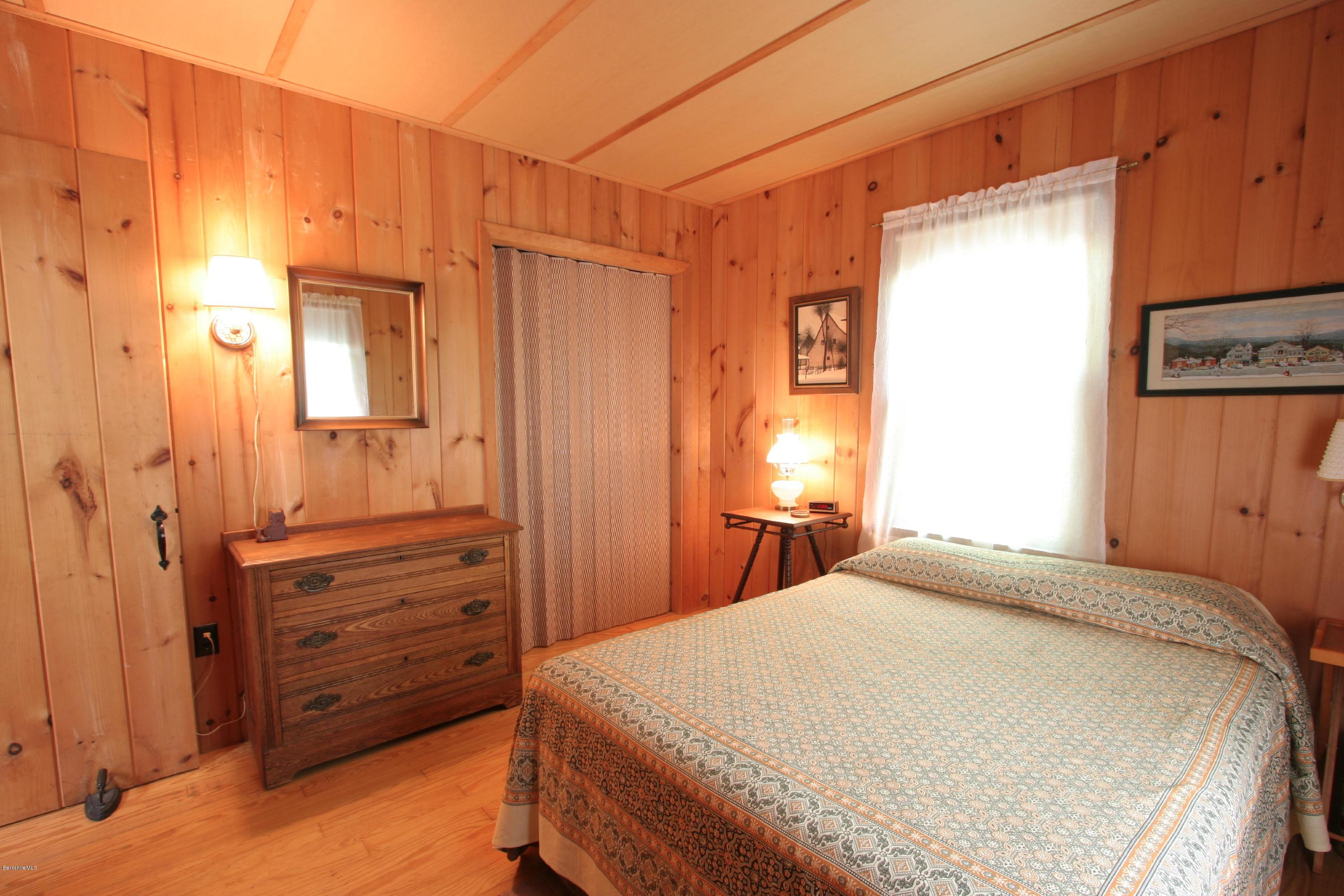 22 Housatonnuck Road Stockbridge, MA 01262 - Photo 3 of 21 a bedroom with a bed and a dresser