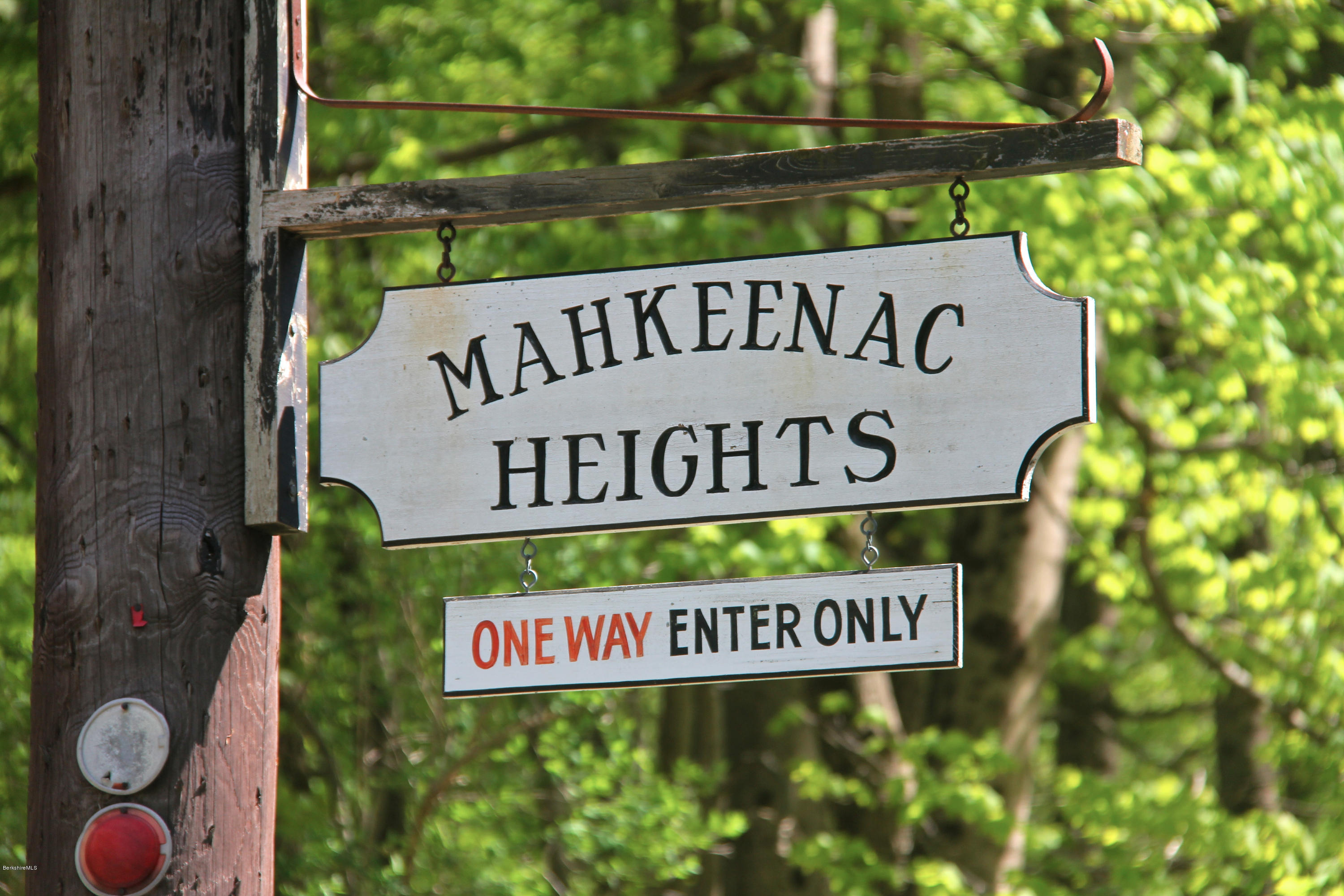 22 Housatonnuck Road Stockbridge, MA 01262 - Photo 21 of 21 a sign broad on wooden wall