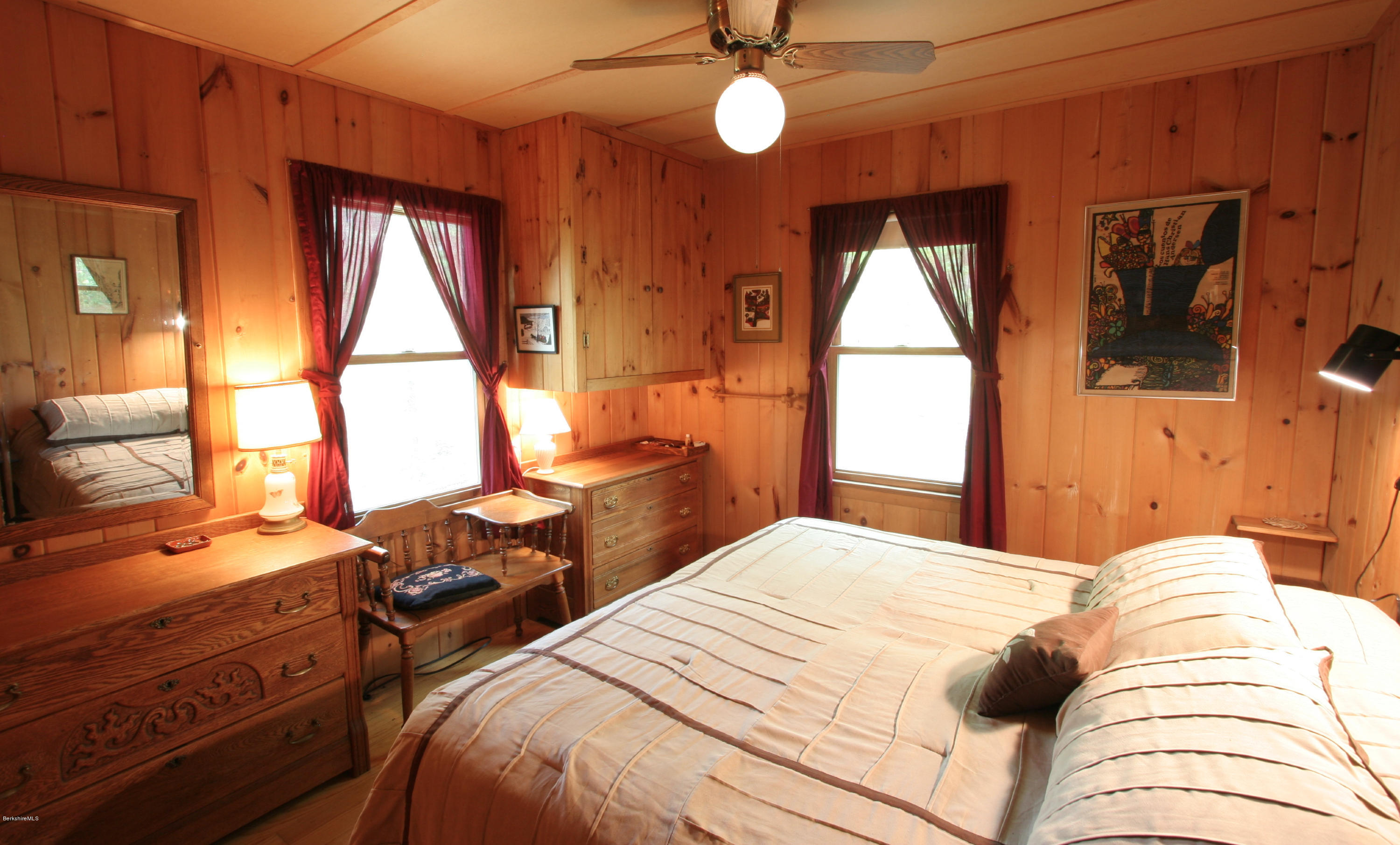 22 Housatonnuck Road Stockbridge, MA 01262 - Photo 7 of 21 a bedroom with a bed and a chandelier