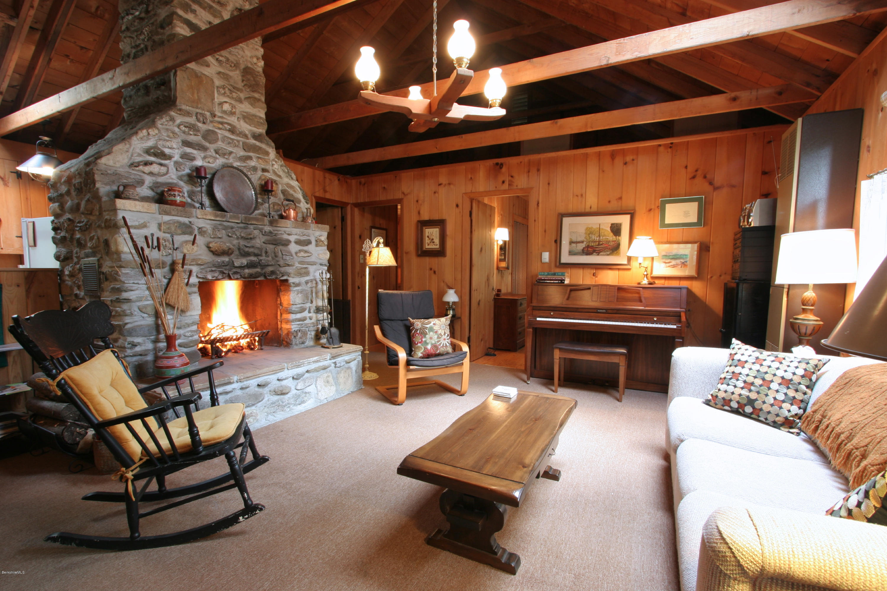 22 Housatonnuck Road Stockbridge, MA 01262 - Photo 8 of 21 a living room with furniture and a fireplace