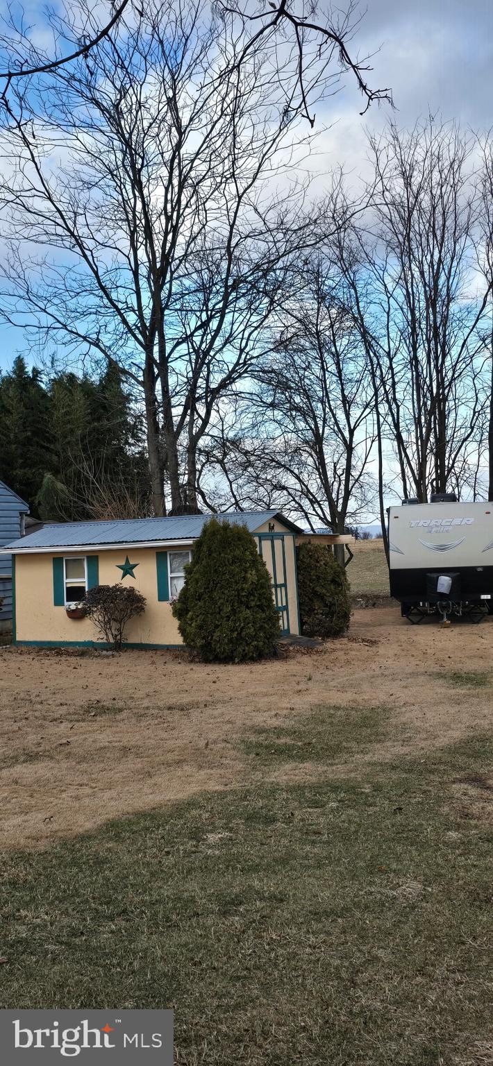 1447 Crottlestown Road Chambersburg, PA 17202 - Photo 16 of 16 a front view of a house with a yard
