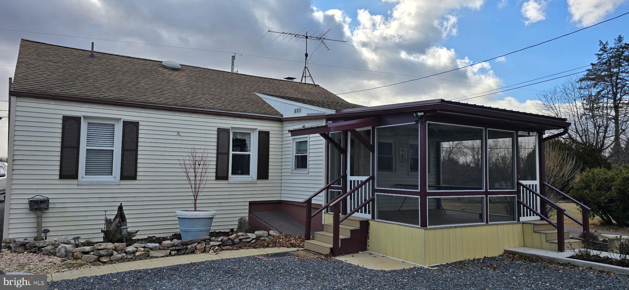 1447 Crottlestown Road Chambersburg, PA 17202 - Photo 3 of 16 a view of a house with a door and wooden fence