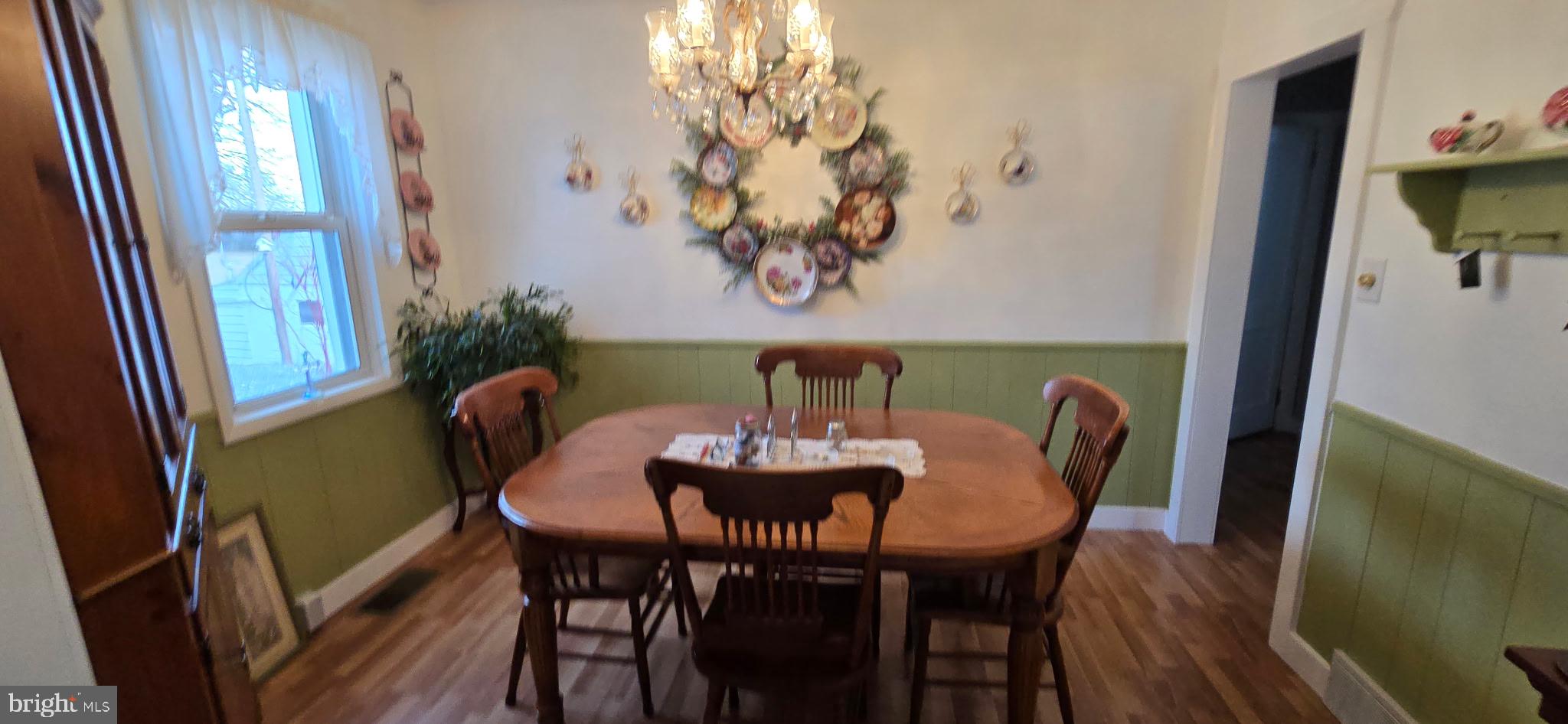 1447 Crottlestown Road Chambersburg, PA 17202 - Photo 9 of 16 a view of a dining room with furniture and wooden floor