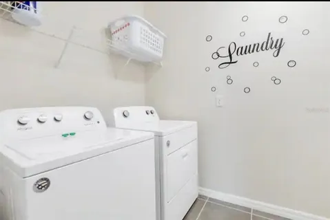 a view of a patio with couches table and chairs and potted plants