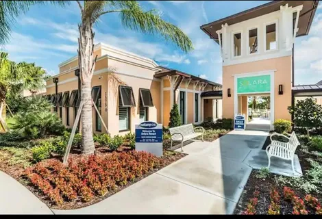 a bathroom with a shower sink and mirror