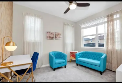 a view of a patio with a table and chairs under an umbrella