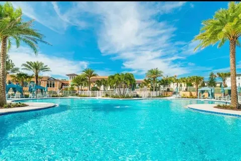 a front view of a building with potted plants