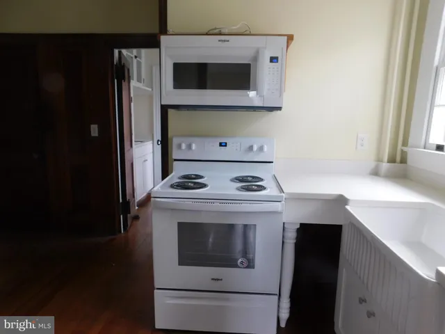 a kitchen with a stove and a microwave