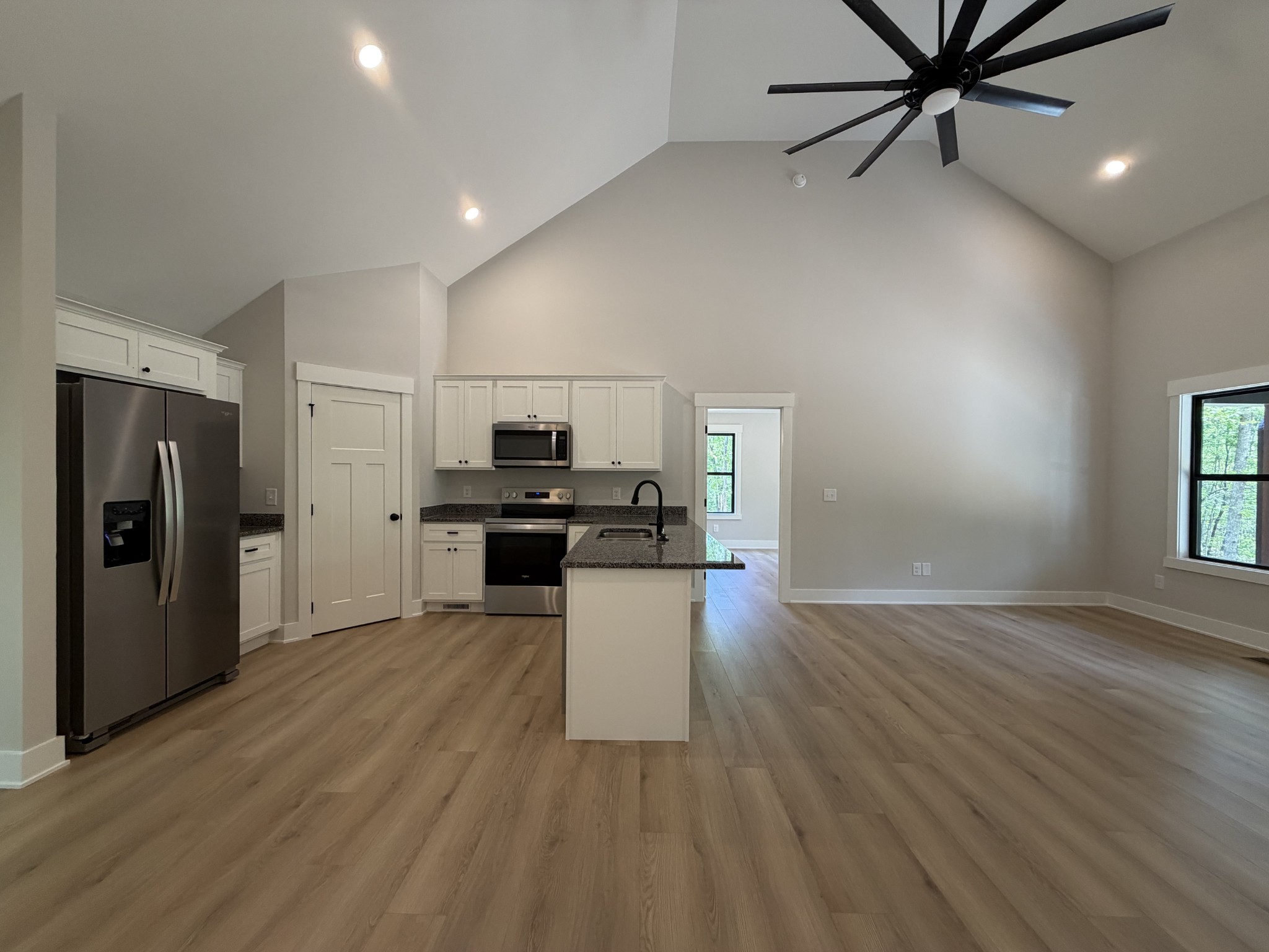1007 Mt Olive Road Westmoreland, TN 37186 - Photo 14 of 31 a kitchen with a refrigerator and a stove top oven