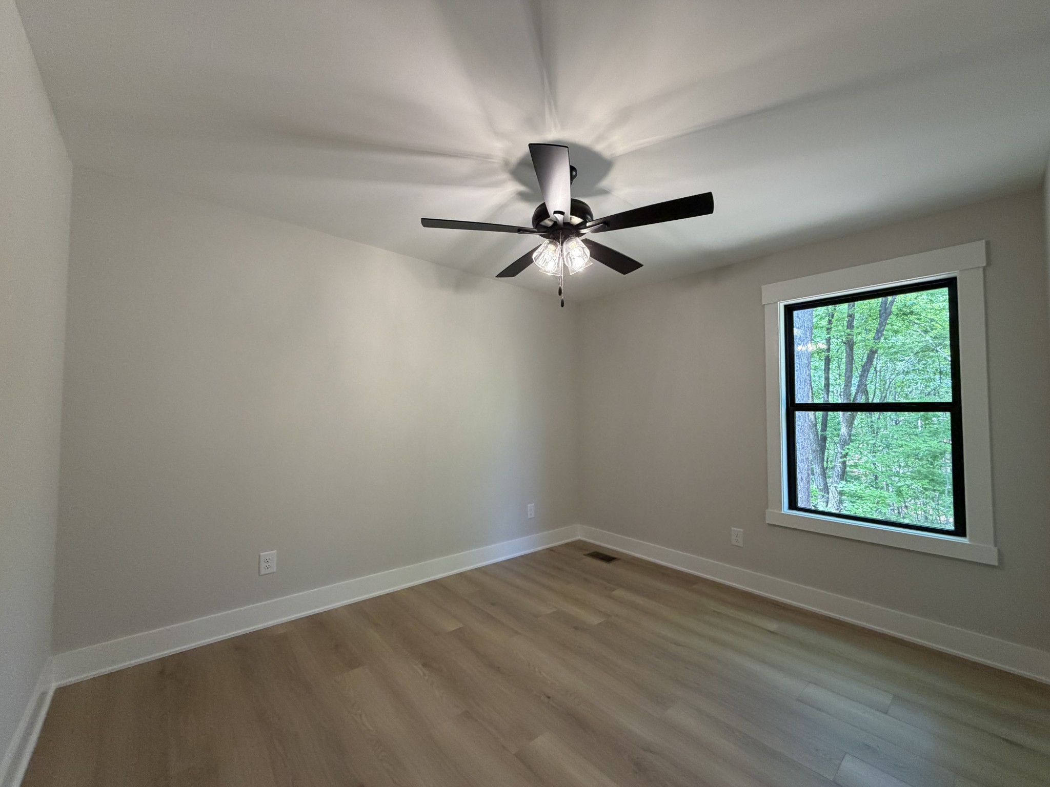 1007 Mt Olive Road Westmoreland, TN 37186 - Photo 23 of 31 an empty room with a window and a fan
