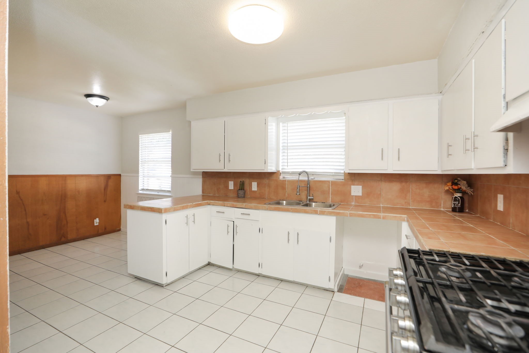 8235 Dover Street Houston, TX 77061 - Photo 16 of 36 a kitchen with a sink and cabinets