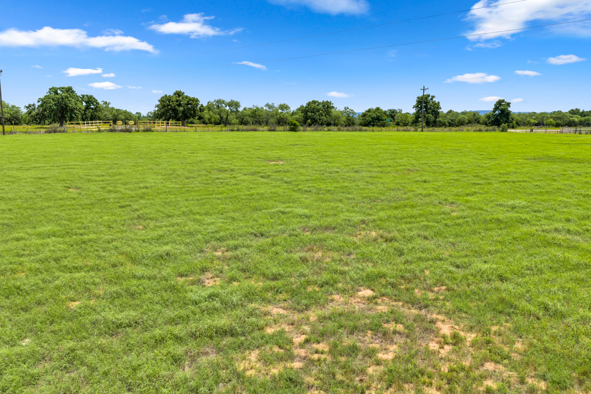 6311 Ranch Road 2241 Bluffton, TX 78607 - Photo 26 of 32 a view of a lake from a yard