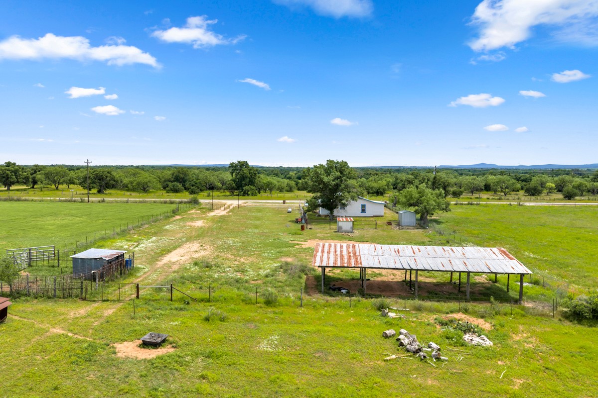 6311 Ranch Road 2241 Bluffton, TX 78607 - Photo 28 of 32 a view of a lake with a big yard