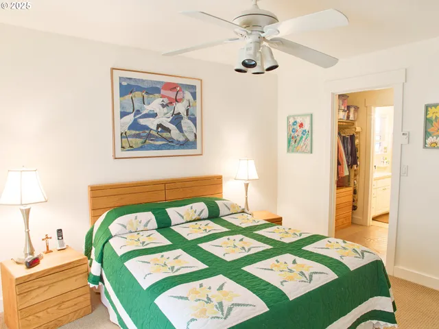 a bed room with a bed and a table