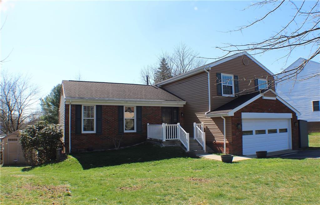 9462 Peebles Road Allison Park, PA 15101 - Photo 1 of 50 a front view of a house with a yard and garage