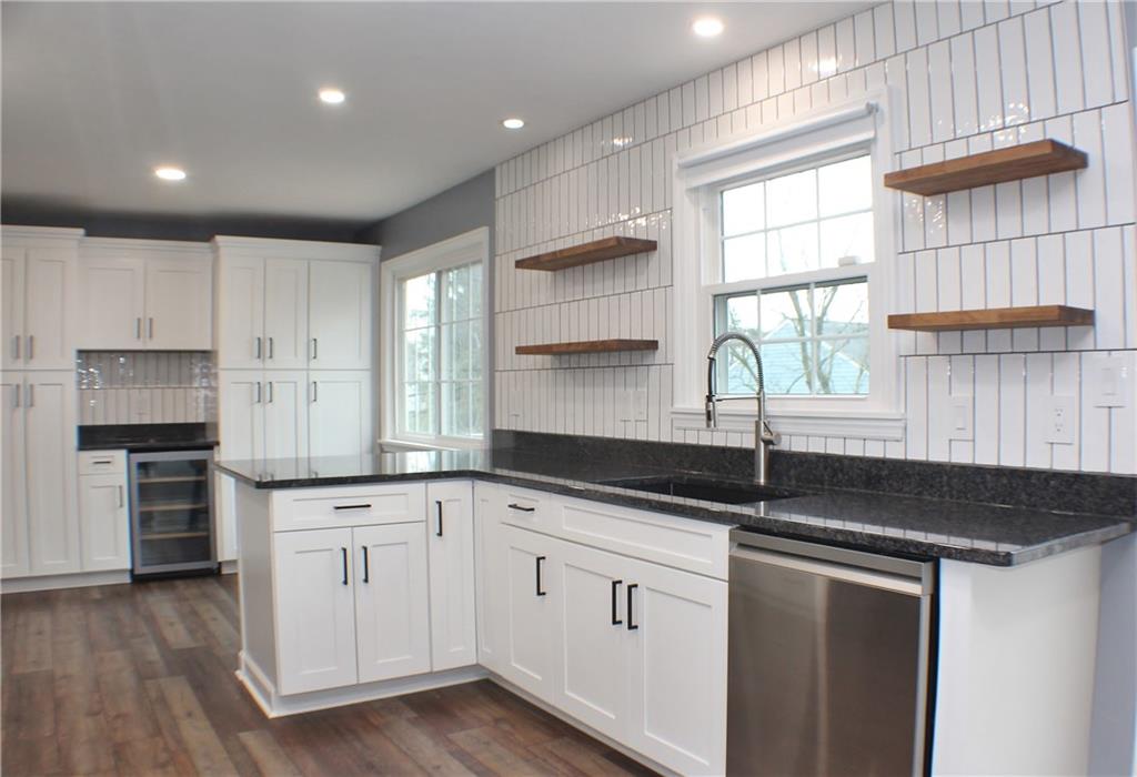 9462 Peebles Road Allison Park, PA 15101 - Photo 11 of 50 a kitchen with granite countertop a sink and cabinets