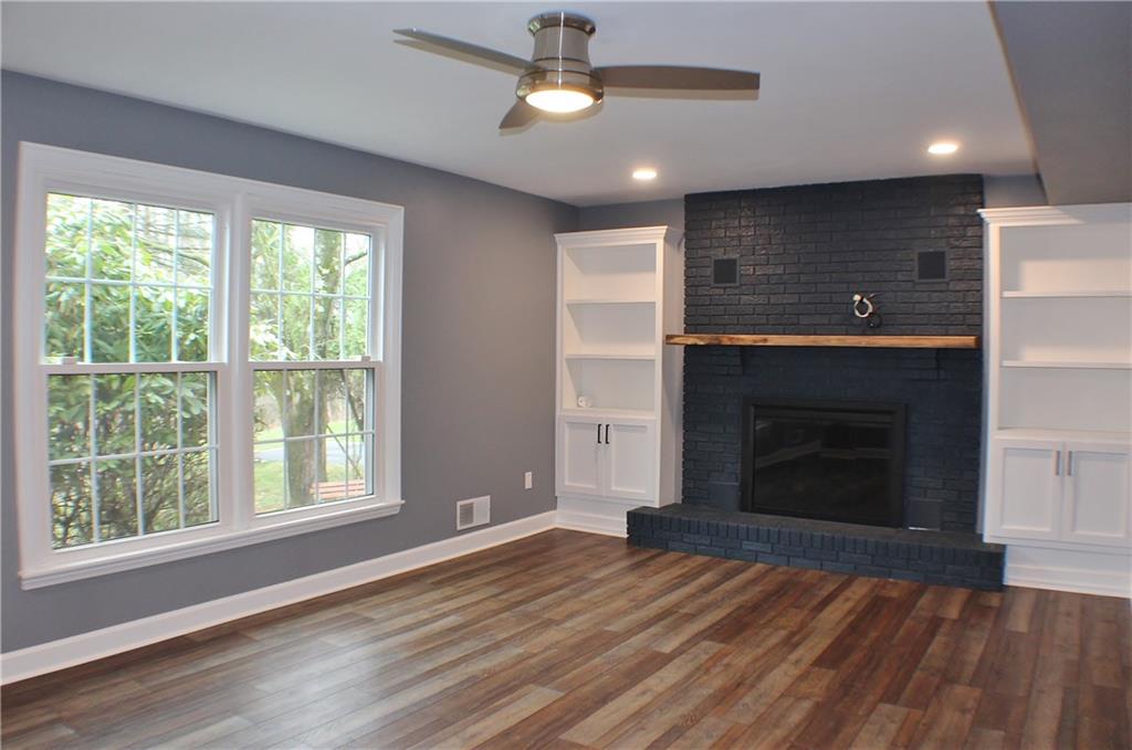 9462 Peebles Road Allison Park, PA 15101 - Photo 14 of 50 a view of empty room with wooden floor and fireplace