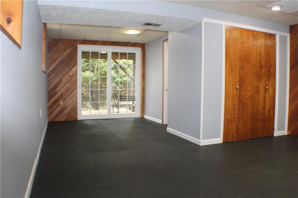 9462 Peebles Road Allison Park, PA 15101 - Photo 21 of 50 an empty room with windows lake and mountain view
