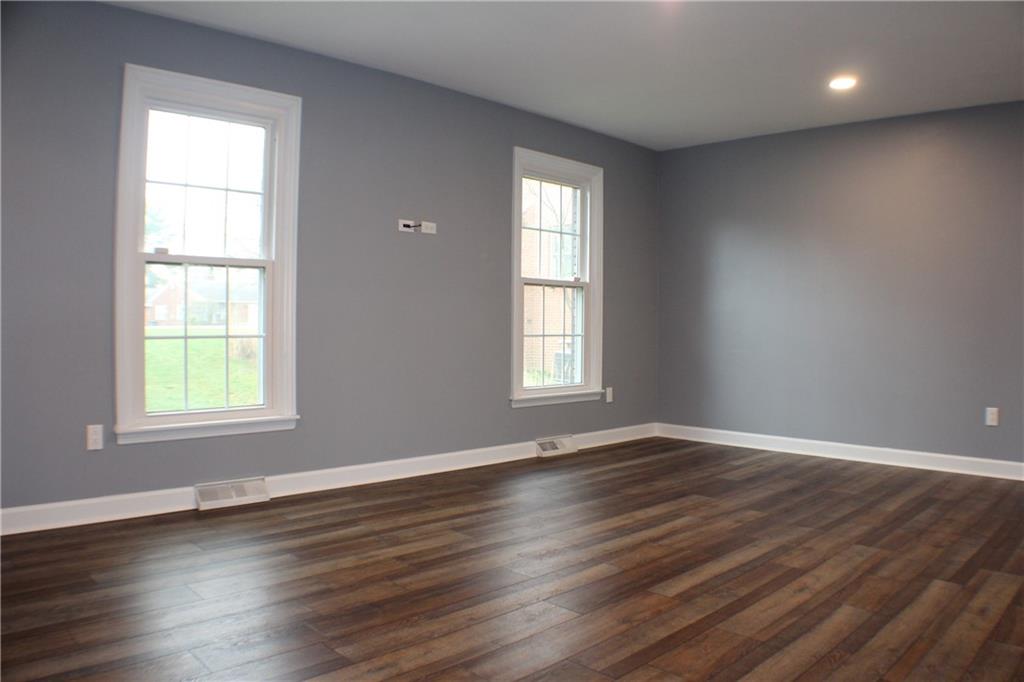 9462 Peebles Road Allison Park, PA 15101 - Photo 27 of 50 an empty room with wooden floor and windows