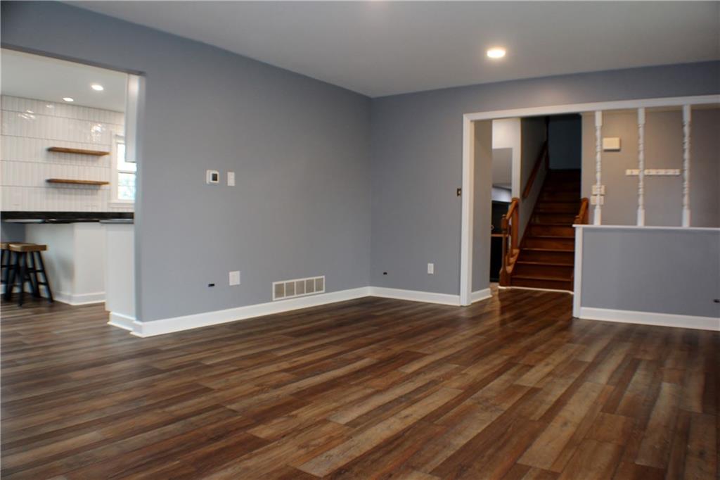 9462 Peebles Road Allison Park, PA 15101 - Photo 29 of 50 an empty room with wooden floor and stairs
