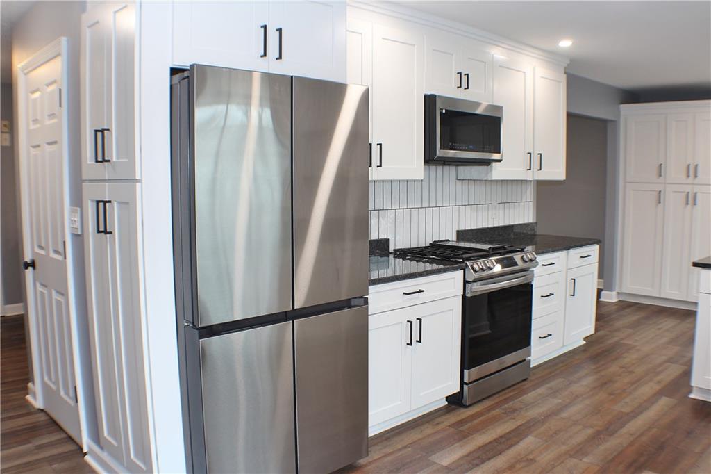9462 Peebles Road Allison Park, PA 15101 - Photo 3 of 50 a kitchen with stainless steel appliances a refrigerator stove and microwave