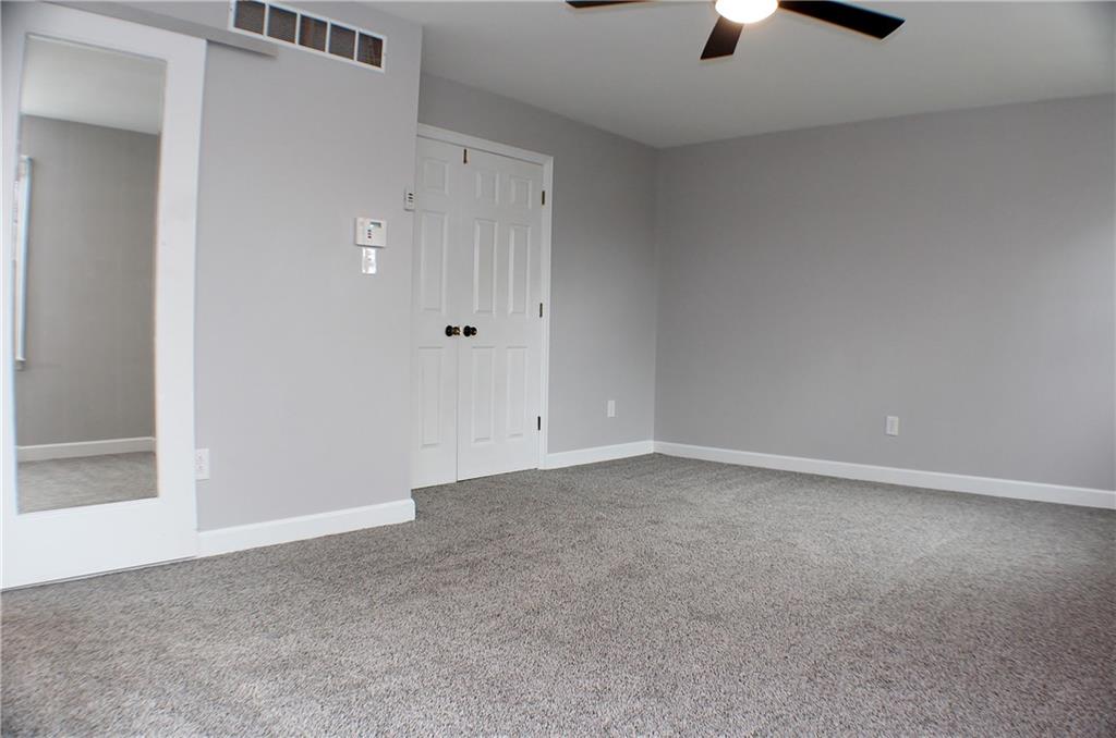 9462 Peebles Road Allison Park, PA 15101 - Photo 31 of 50 an empty room with a ceiling fan and window