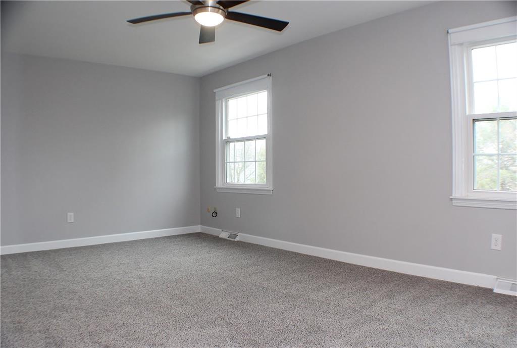 9462 Peebles Road Allison Park, PA 15101 - Photo 32 of 50 an empty room with windows and fan