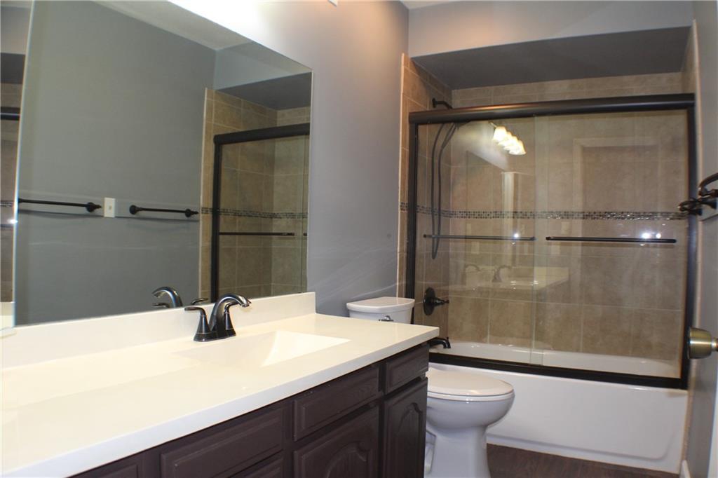 9462 Peebles Road Allison Park, PA 15101 - Photo 37 of 50 a bathroom with a sink mirror toilet and shower