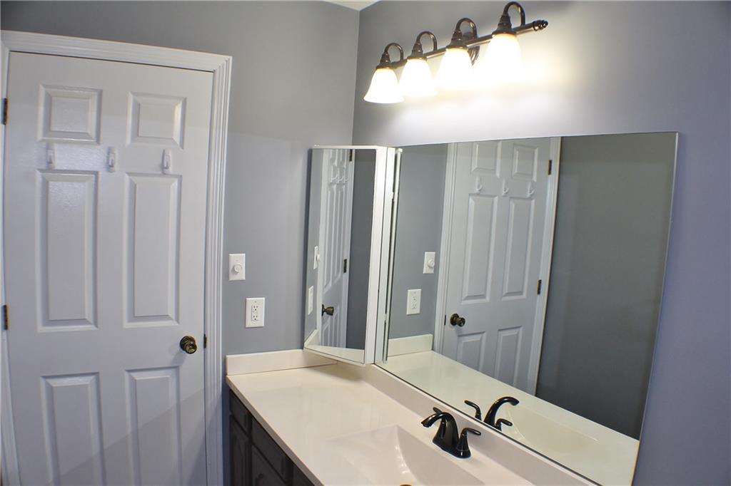 9462 Peebles Road Allison Park, PA 15101 - Photo 38 of 50 a bathroom with a sink and mirror