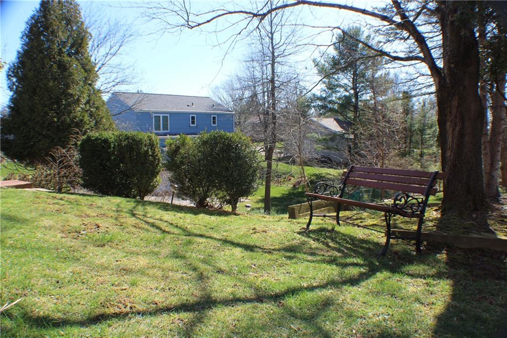 9462 Peebles Road Allison Park, PA 15101 - Photo 48 of 50 a view of a bench in a backyard of a house