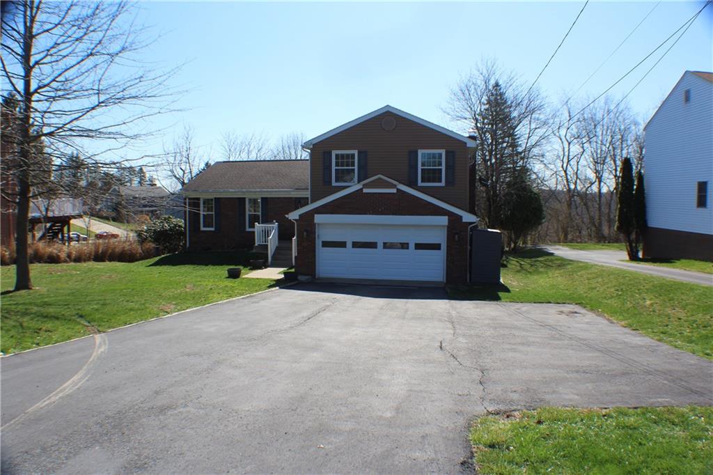 9462 Peebles Road Allison Park, PA 15101 - Photo 49 of 50 a front view of a house with a yard and garage