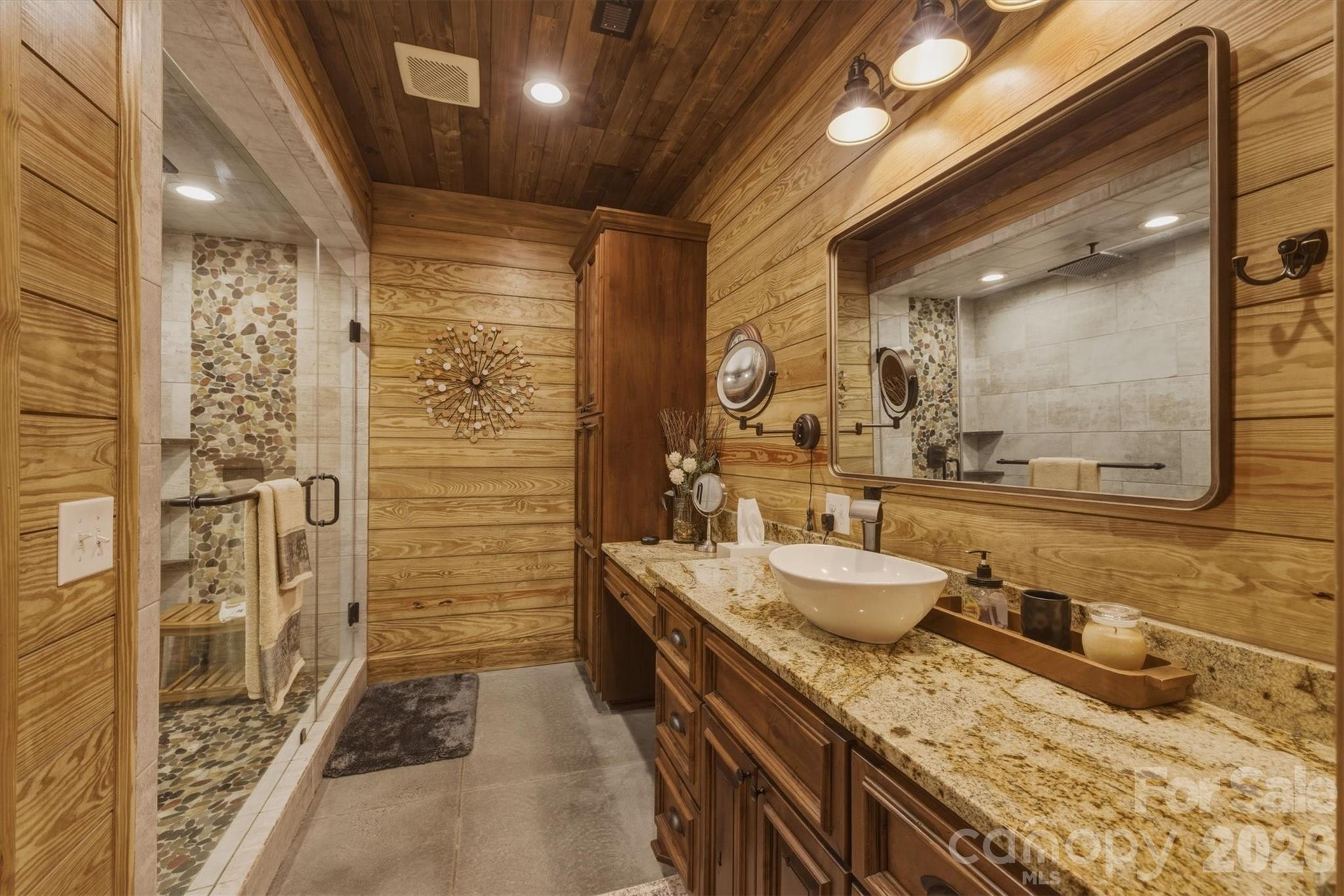 7490 Oak Ridge Church Road Connelly Springs, NC 28612 - Photo 23 of 44 a bathroom with a granite countertop sink a toilet and shower