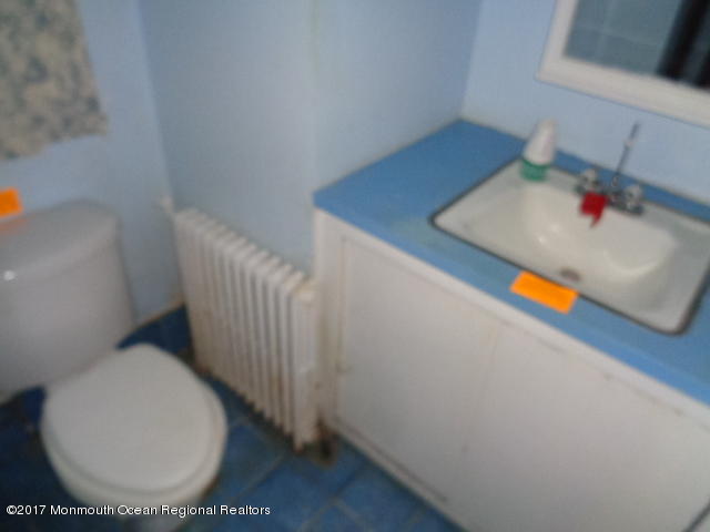 90 Jackson Mills Road Freehold, NJ 07728 - Photo 13 of 18 a bathroom with a toilet and sink