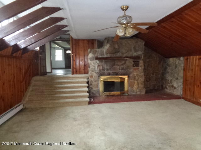 90 Jackson Mills Road Freehold, NJ 07728 - Photo 14 of 18 a view of fireplace and utility room