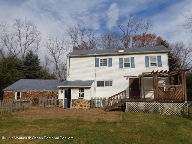 90 Jackson Mills Road Freehold, NJ 07728 - Photo 16 of 18 a front view of a house with a yard