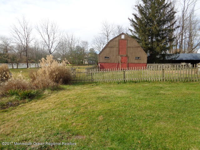 90 Jackson Mills Road Freehold, NJ 07728 - Photo 17 of 18 a view of backyard with garden and trees
