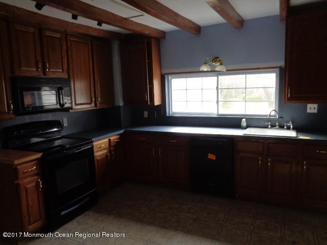 90 Jackson Mills Road Freehold, NJ 07728 - Photo 4 of 18 a kitchen with a sink stove and microwave