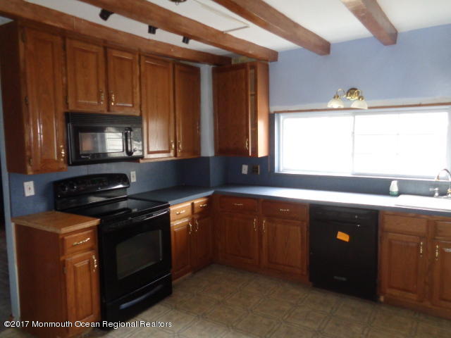 90 Jackson Mills Road Freehold, NJ 07728 - Photo 5 of 18 a kitchen with a stove and a sink
